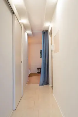 a hallway with a door leading to a room at HostWise - Artistic Escape with Modern Comfort in Vila Nova de Gaia