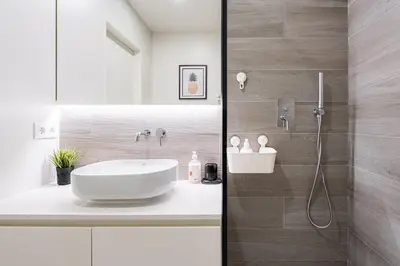 a bathroom with a sink and a shower at GuestReady - Mandariam Studio in Porto