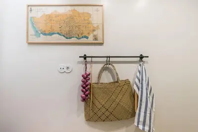 a purse hanging on a wall with a map at GuestReady - Visconde Mezzanine in Porto