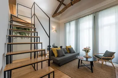 a living room with a couch and a table at GuestReady - Visconde Mezzanine in Porto