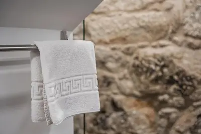 a towel hanging on a towel rack in a bathroom at GuestReady - Boutique style loft in Constitution in Porto