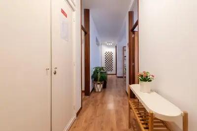 a hallway with a bench and a potted plant at Botanic Jungle at Porto Downtown in Porto