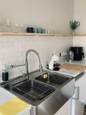 a kitchen counter with a sink in a kitchen at Trindade Studio by Portomosa in Porto