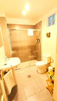 a bathroom with a shower and a toilet and a sink at Porto Downtown in Porto