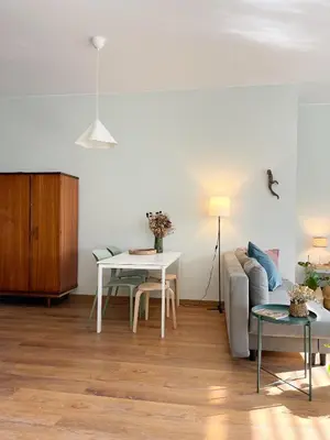 a bedroom with a bed and a living room at Casa Sophia in Porto