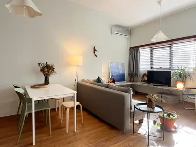 a living room with a couch and a table at Casa Sophia in Porto