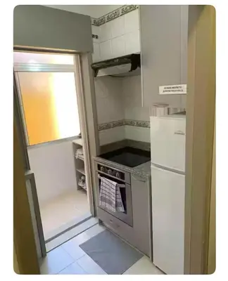a small kitchen with a refrigerator and an oven at Best Stay in Porto in Porto