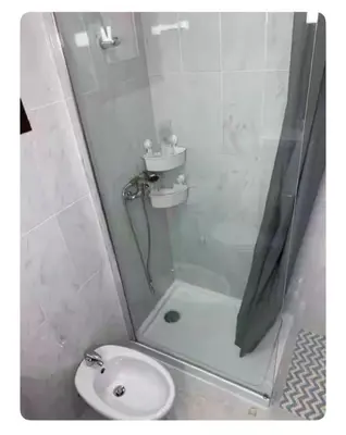 a bathroom with a shower and a toilet and a sink at Best Stay in Porto in Porto