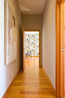 a hallway with a door leading to a dining room at Boutique Rentals-SãO bEnTo Ribeira Apt in Porto