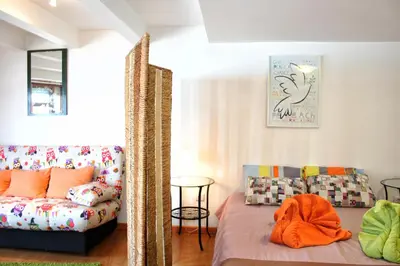 a living room with a couch at Estúdio com vistas rio Douro in Vila Nova de Gaia