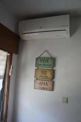 a sign hanging on a wall in a room at Casa no centro histórico in Vila Nova de Gaia