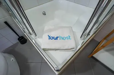 a towel with the words your most written on it in a bathroom at Oporto Center at Your Doorstep 1 in Porto