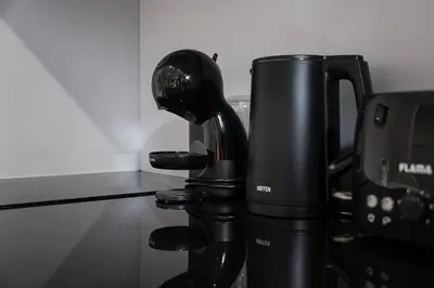 a coffee cup sitting on top of a coffee machine at GuestReady - Welcoming place in Porto in Porto
