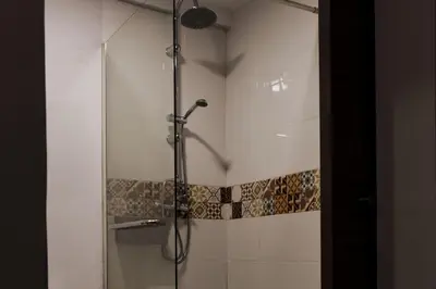 a bathroom with a sink with a soap bottle on it at Porto's secret backyard in Porto