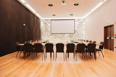 a conference room with a long table and chairs at The Log Porto Hotel by Piamonte Hotels in Porto