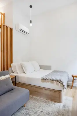 a flat screen tv hanging on a wall at 252 Heroísmo Duplex Flat in Porto