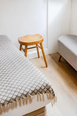 a bedroom with a bed with white sheets and pillows at 252 Heroísmo Duplex Flat in Porto