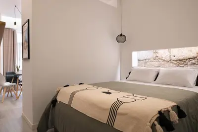 a bedroom with a bed with a blanket on it at St Ildefonso 02 in Porto