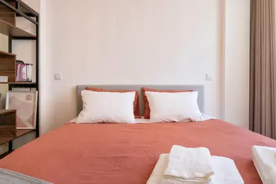 a bedroom with a bed with two pillows at St Ildefonso 05 in Porto