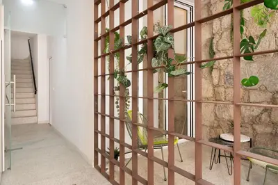 a room with a wall with plants on it at St Ildefonso 06 in Porto