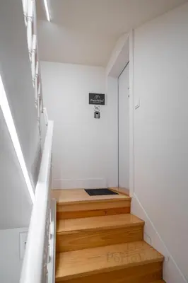 a bedroom with a bed and a night stand with a lamp at Vaz Porto Apartment - Porto Velho Apt in Porto