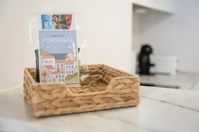 a basket with a book on top of a table at GuestReady - Homely stay in Porto in Porto