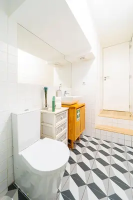 a bathroom with a toilet and a sink at Cosy Charm Bonfim in Porto