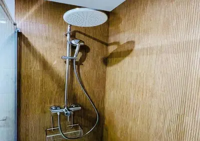 a shower in a bathroom with a shower head at Trindade 99 - Porto Downtown Apartment in Porto