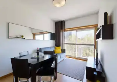 a living room with a table and a couch at Trindade 99 - Porto Downtown Apartment in Porto