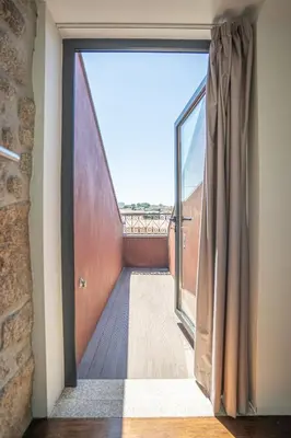 an open door to a balcony with a view at CHARM by YoursPorto in Vila Nova de Gaia