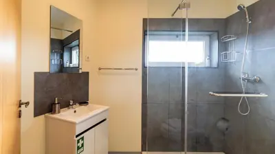 a bathroom with a shower and a sink at 2BR Home near Douro River by LovelyStay in Vila Nova de Gaia