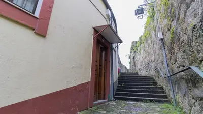 an alley with stairs leading up to a building at 2BR Home near Douro River by LovelyStay in Vila Nova de Gaia