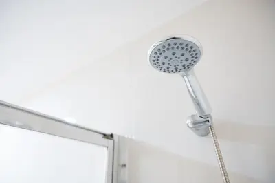 a bathroom sink with two faucets on a counter at GuestReady - Easygoing Pool to River in Vila Nova de Gaia