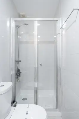 a shower head on the wall in a bathroom at GuestReady - Easygoing Pool to River in Vila Nova de Gaia