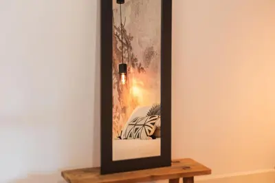 a picture frame on a table in a room at Classy Garden in Porto