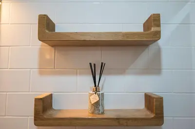 a vase with sticks in it sitting on a shelf at Classy Garden in Porto