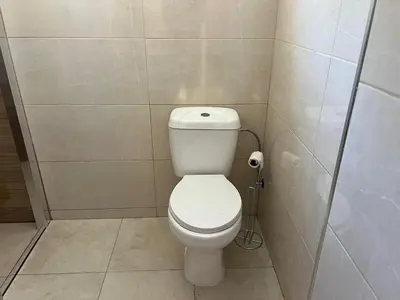 a bathroom with a white toilet in a stall at River Pace III in Porto