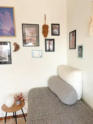 a shelf with a radio and books on it at Casa Guilhermina, Sunny Studio with Balcony in Porto