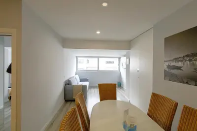 a spiral staircase in a kitchen with white cabinets at Happy Downtown Apartments by PCH in Porto