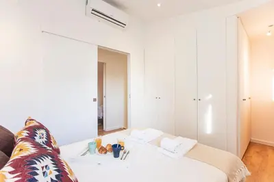 a living room with a couch and a table at FLH Porto Central TownHouse in Porto