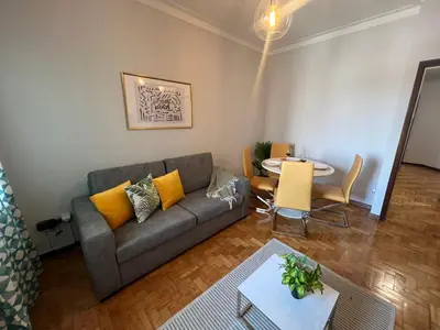 a living room with a couch and a table at Happy Mountain in Porto