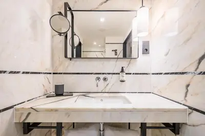 a bathroom with a sink and a mirror at Descobertas Boutique Hotel by Aspasios in Porto