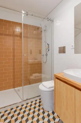 a bathroom with a shower and a toilet and a sink at Topazio Apartment by Porto Stories in Porto