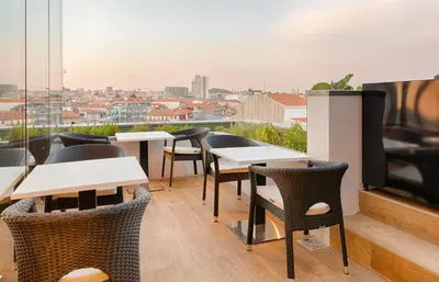 a group of wine bottles sitting on a table at Hotel Premium Porto Downtown in Porto