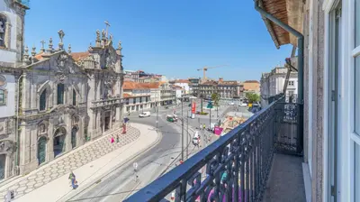 a view of a city street from a balcony at Carmo Apartamentos in Porto