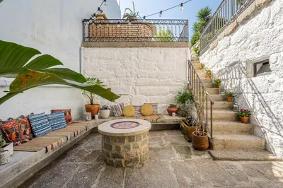 a group of stairs with potted plants on them at Hidden Gem near city center- garden, outdoor kitchen, sauna in Porto