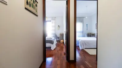 a room with a bedroom with a bed and a mirror at Porto Essence Apartment in Porto