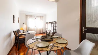 a small balcony with a table in a room at Porto Essence Apartment in Porto
