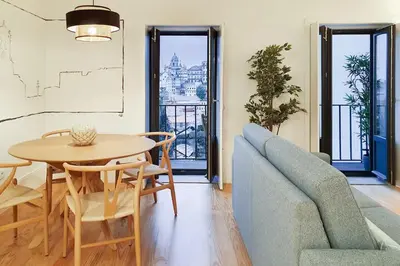 a living room with a table and a couch at Great Flat & View in Historic Porto by LovelyStay in Porto