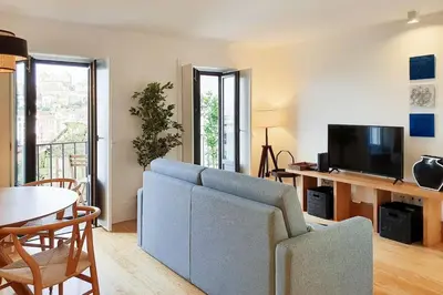 a shower with a glass door in a bathroom at Great Flat & View in Historic Porto by LovelyStay in Porto
